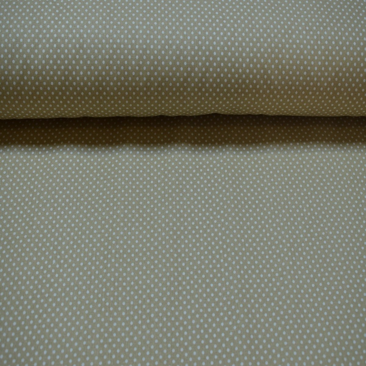 Beige spotted poplin fabric